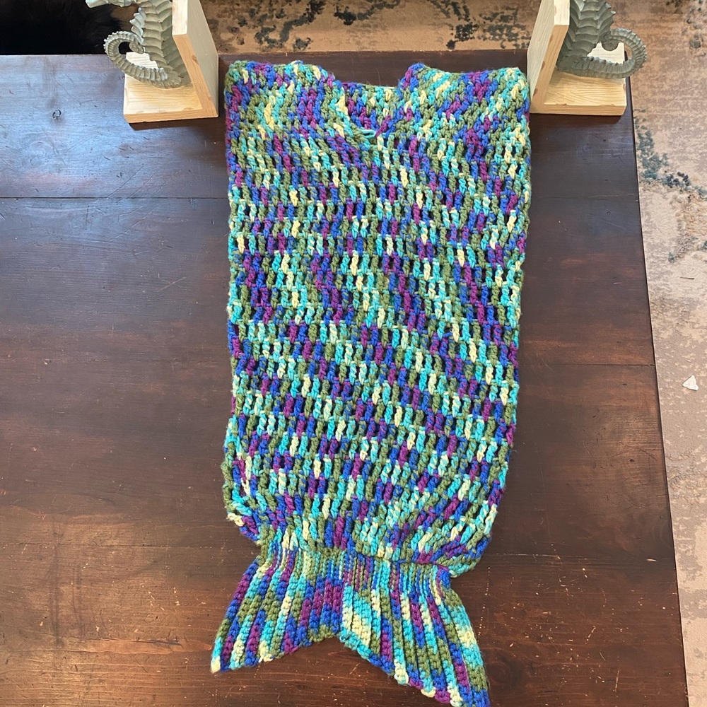 Fun whimsical handmade crochet baby mermaid tail blanket from the little mermaid